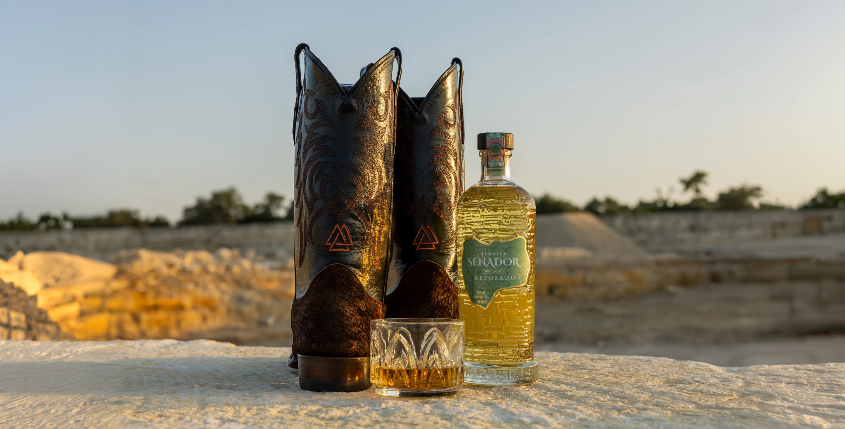 Boots with the Senador mark beside a Reposado pour